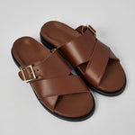 Brown Llafranc men’s leather sandals angled view with buckle