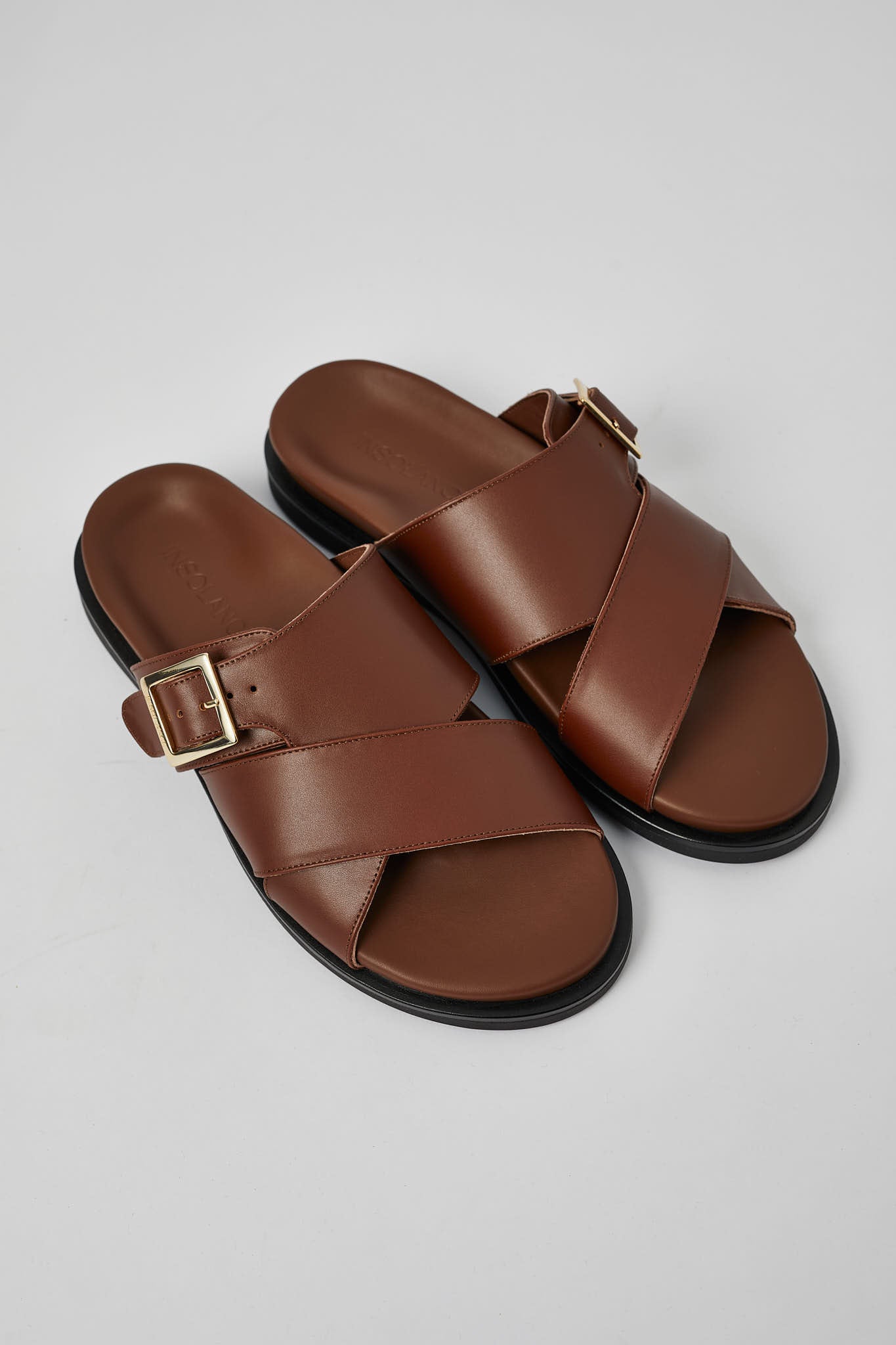 Brown Llafranc men’s leather sandals angled view with buckle