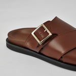 Close-up of brown Llafranc leather sandal with buckle detail