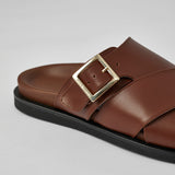 Close-up of brown Llafranc leather sandal with buckle detail