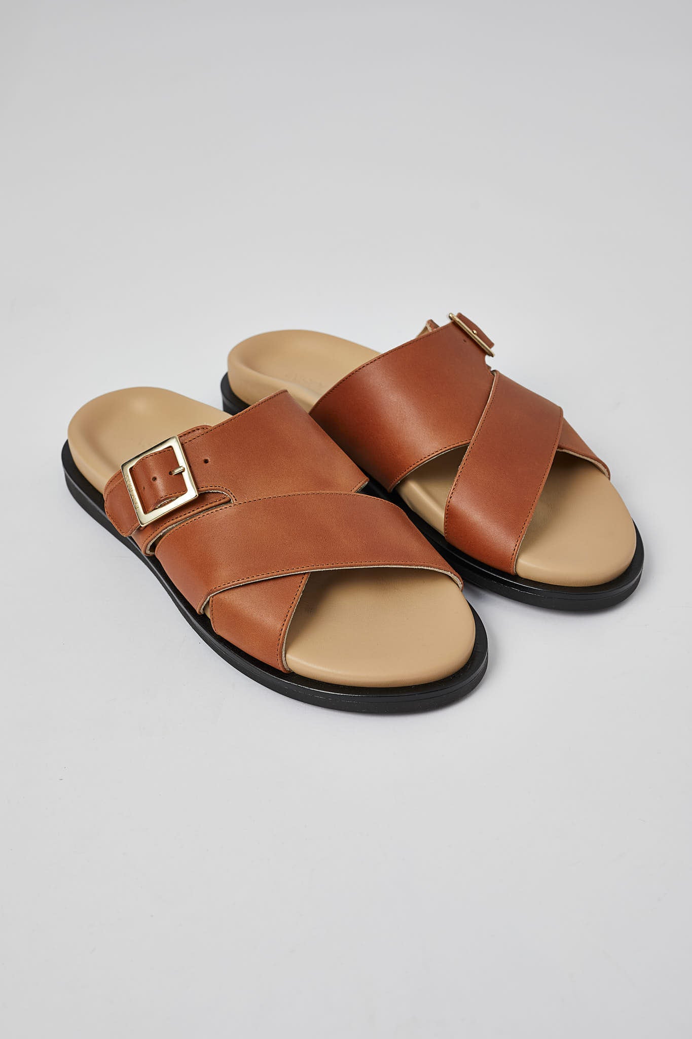 Tan Llafranc men’s leather sandals angled view with buckle