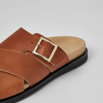 Close-up of tan Llafranc leather sandal with metal buckle
