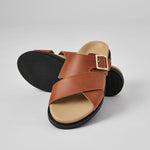 Tan Llafranc handcrafted leather sandal with black sole and adjustable buckle