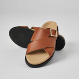 Tan Llafranc handcrafted leather sandal with black sole and adjustable buckle