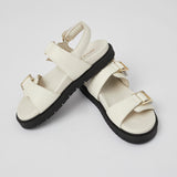 White Barna handcrafted leather sandals with gold buckles